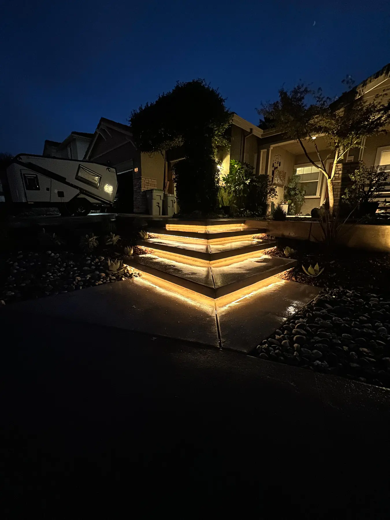 Concrete entry steps with integrated warm lighting