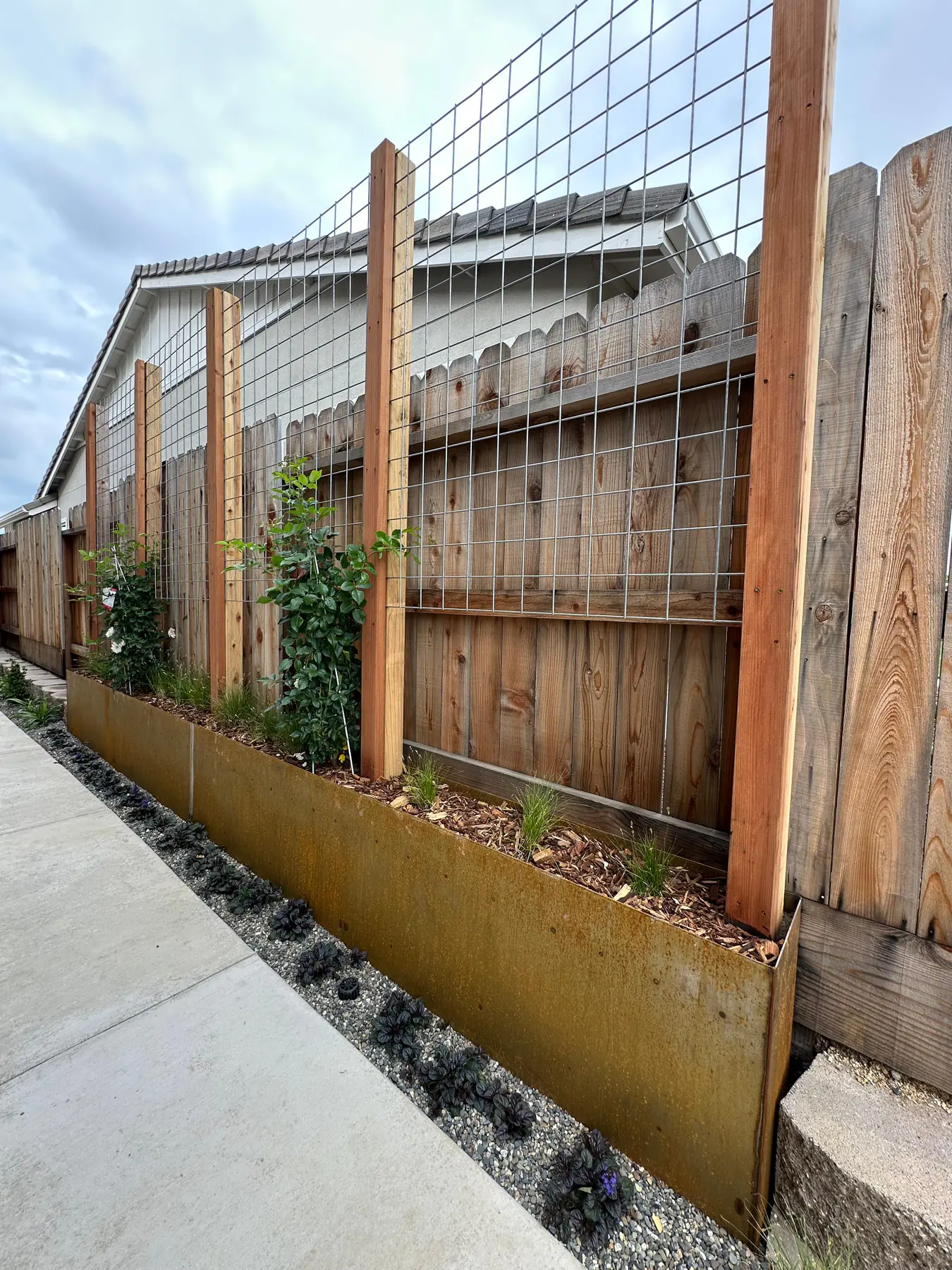Tall wood and wire fence detail