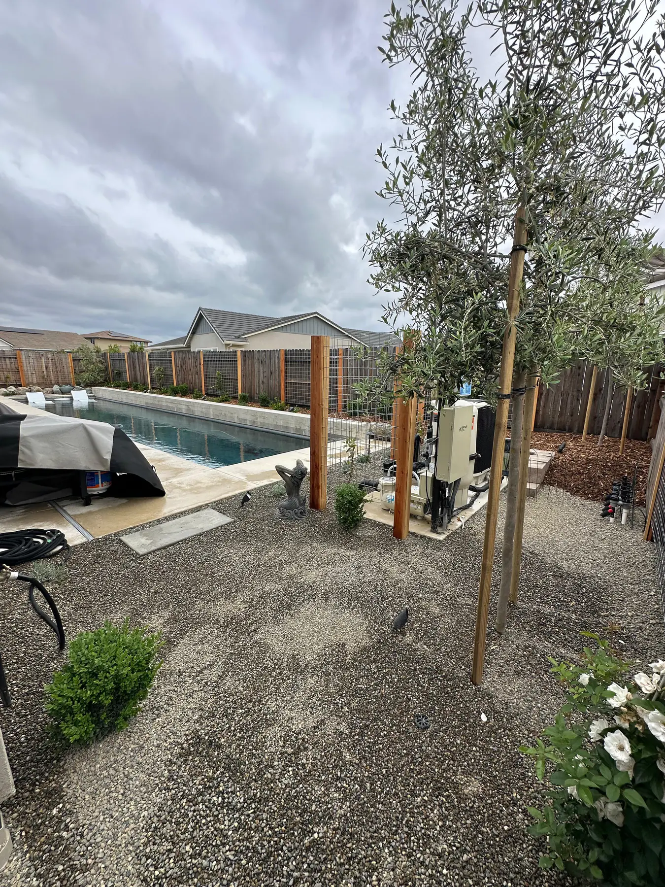 Fence posts and pool equipment screen area