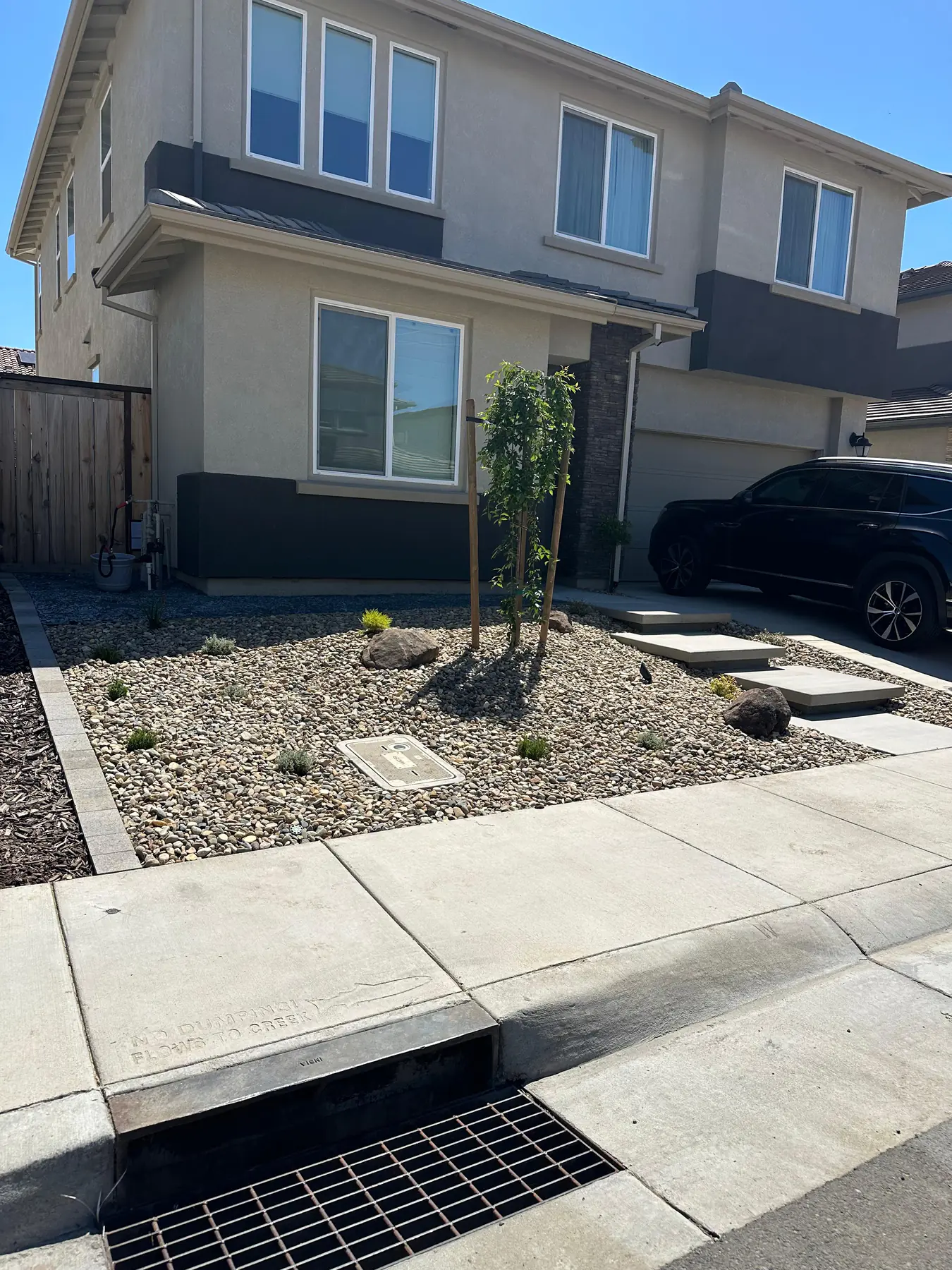 Concrete path and gravel landscape in a front yard